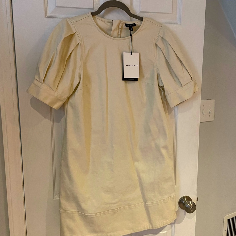 Never worn. New with tags, canvas dress with pockets.